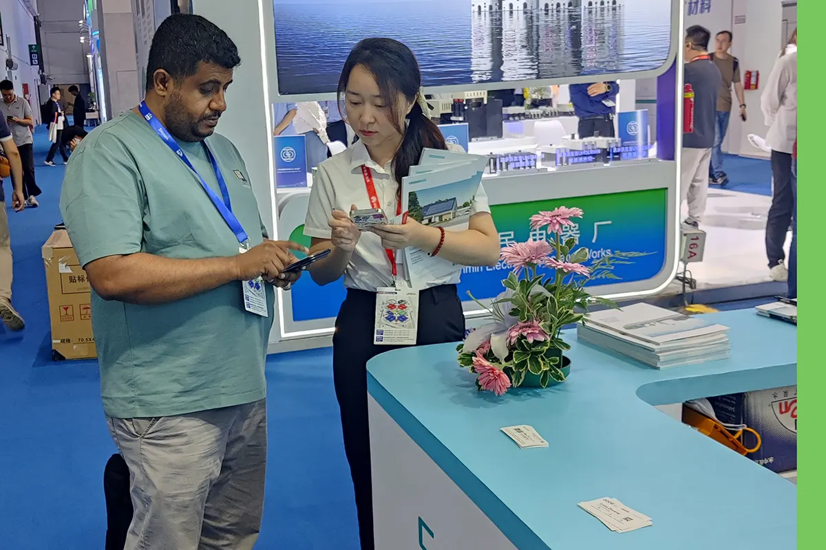 GODE representatives exchange contact details and business cards with clients