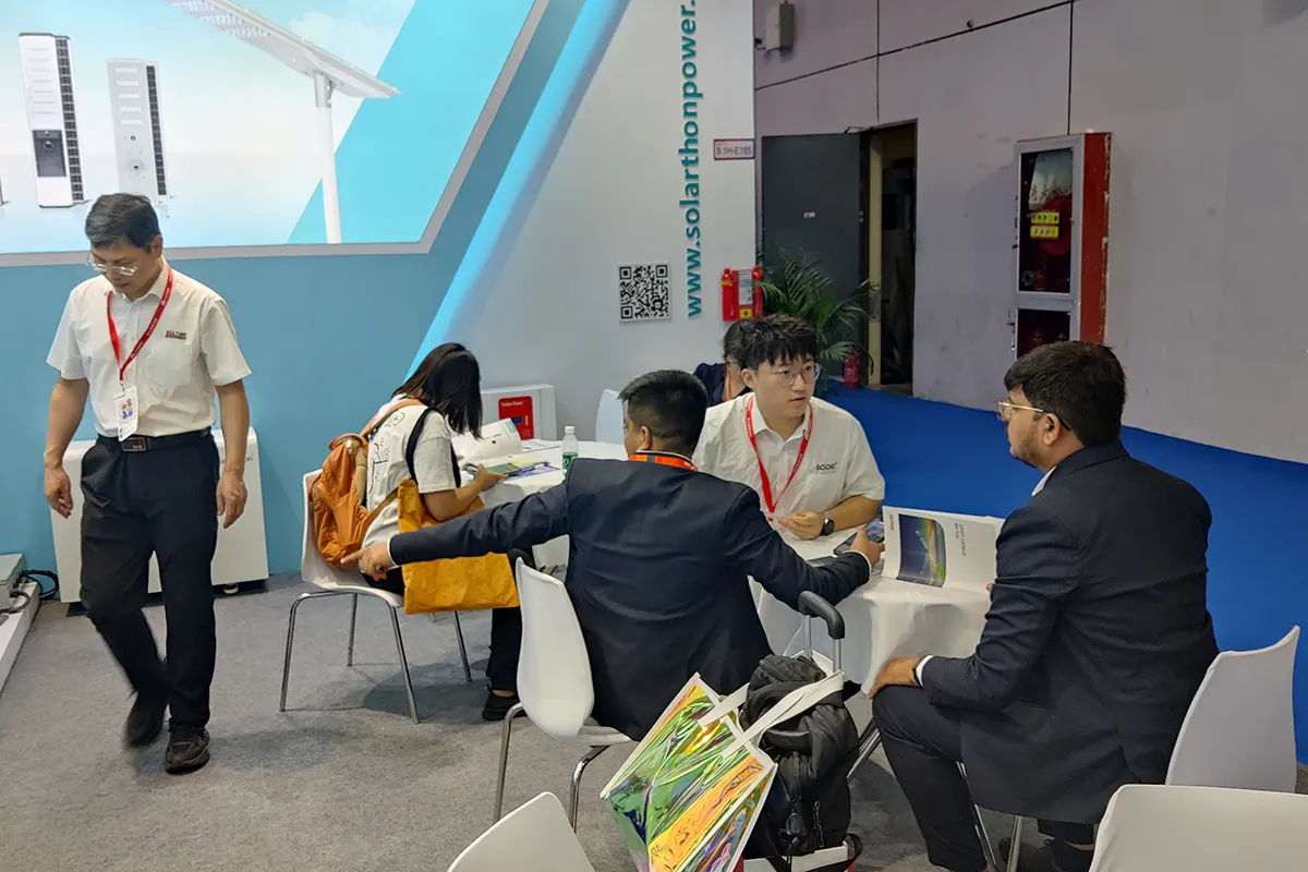 GODE team members introduce product features to booth visitors