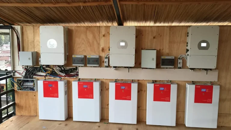 Off-grid solar power system installation featuring LiFePO₄ battery pack and 60kW hybrid inverter in Saudi Arabia.