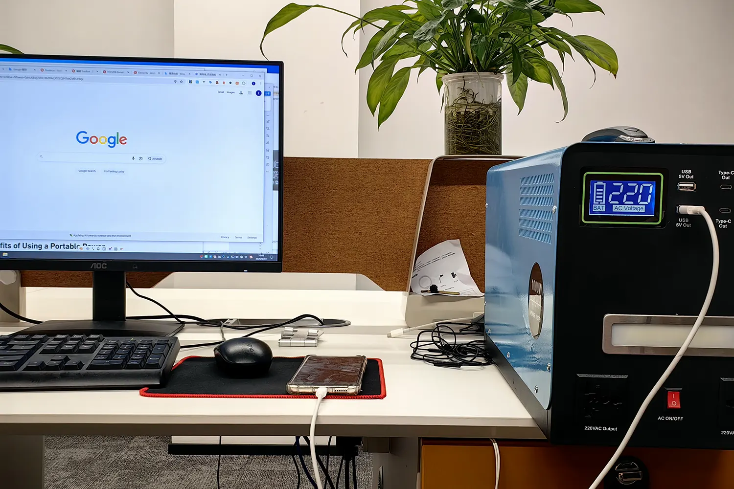 A user in China is using the DQ1208 portable power station to charge his computer and mobile phone.