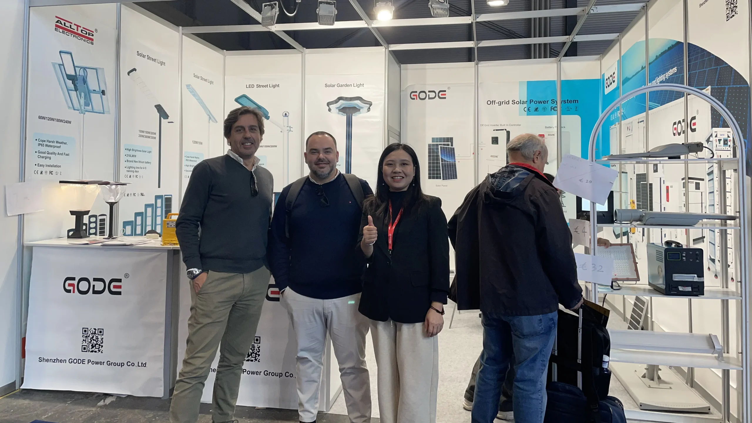 GODE staff and international visitors posing together during the energy exhibition.