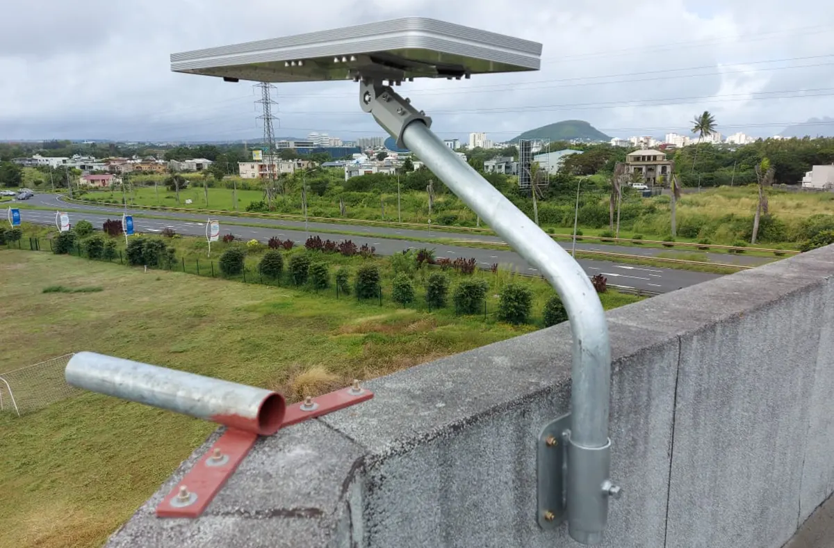 Rooftop installation details of the 0911 50W all-in-one solar LED street light, showing secure mounting and integrated solar lighting design