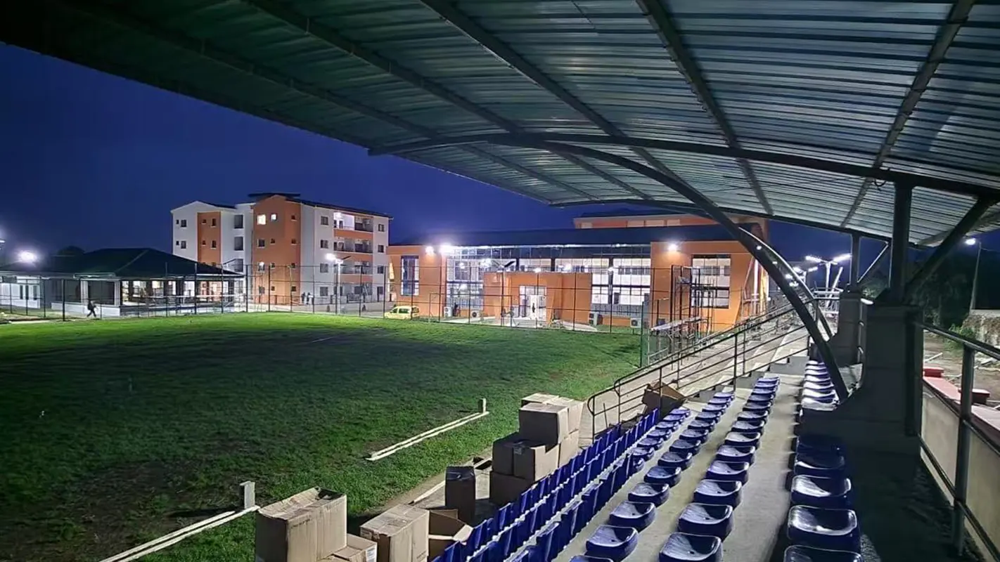Night view of playground spectator stands brightly lit by GODE 150W 0418 Series Solar Street Lights, highlighting safety and energy-efficient lighting.