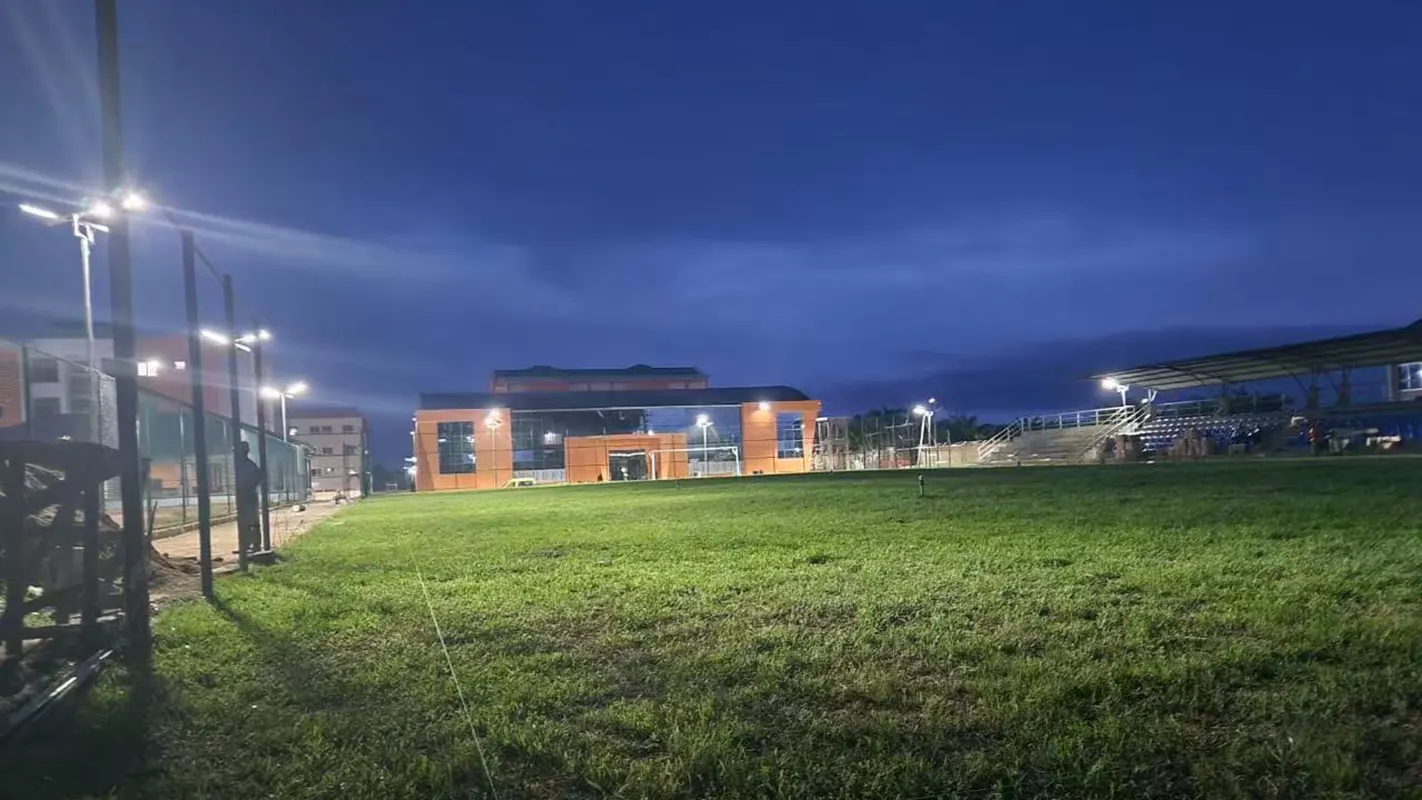 School playground illuminated at night by GODE 150W 0418 Series Solar Street Lights, ensuring safety and clear visibility.